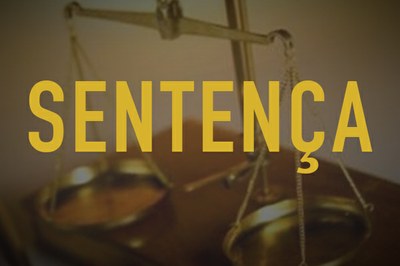 foto da balança da Justiça sobre a qual está escrito da palavra sentença (em amarelo)