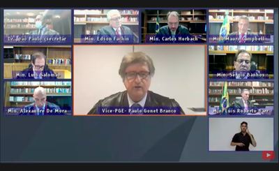 Imagem do print de tela da sessão virtual de abertura do semestre forense no TSE, com o vice-PGE, Paulo Gonet, falando ao centro, e a imagem de todos os ministros da Corte ao redor
