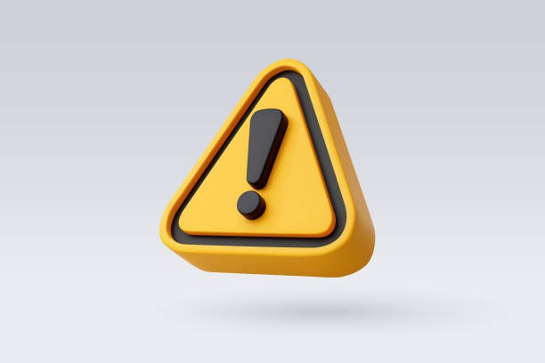 Ícone de alerta em formato triangular, na cor amarela com bordas pretas, contendo um ponto de exclamação preto no centro. O símbolo tem aparência tridimensional e está sobre um fundo cinza claro.