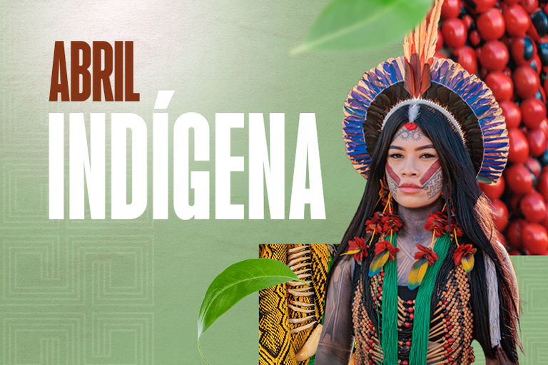 Esta imagem é um banner digital intitulado "Abril Indígena", composto por uma colagem que celebra a cultura dos povos originários. À direita, destaca-se o retrato de uma mulher indígena com pinturas faciais tradicionais, usando um cocar de penas azuis e vermelhas e colares ornamentados com sementes e fibras naturais. O fundo é predominantemente verde com texturas que remetem a grafismos indígenas e folhas sobrepostas, enquanto o lado direito exibe sementes vermelhas vibrantes (urucum). O texto à esquerda utiliza uma tipografia robusta, com a palavra "ABRIL" em marrom e "INDÍGENA" em letras brancas alongadas, criando um visual focado na conscientização e valorização cultural.