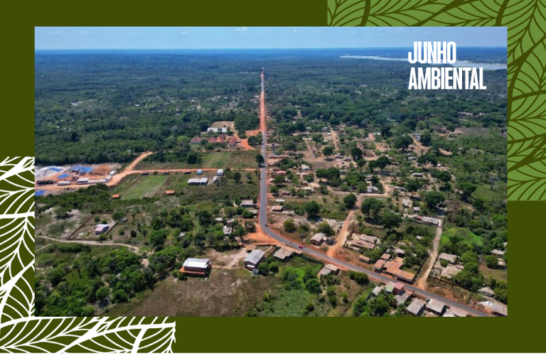 Foto aérea mostra casas e rua recém-asfaltada da Vila Amazônia