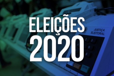 A imagem mostra uma urna de votação eletrônica em umfundo escuro e tem as palavras em cor branca: Eleições 2020