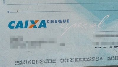 Imagem ilustrativa de um cheque da Caixa