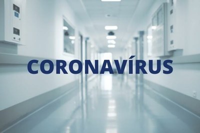 #Pracegover Imagem de corredor de hospital em tons de azul com a inscrição coronavírus